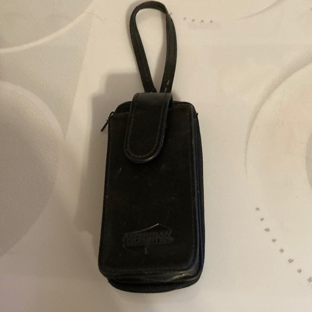 Small American Tourister purse. Will hold cards, license, money, small cellphone